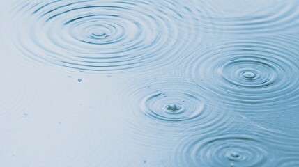 Fototapeta premium A serene close-up of ripples forming in water, creating a peaceful, rhythmic pattern that reflects tranquility.