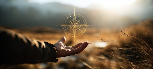 A hand outstretched offers a glowing compass in a vast, sunlit wilderness