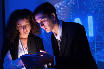 Professionals discussing artificial intelligence trends during a nighttime session in a modern office environment