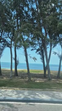 road along the coast of Samila Beach in Songkhla, Thailand