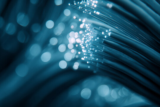 Abstract blue light streams symbolizing high-speed data flow, time, and digital connectivity.