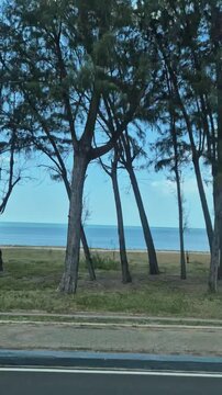 road along the coast of Samila Beach in Songkhla, Thailand