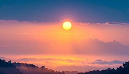 Sunrise over misty mountains