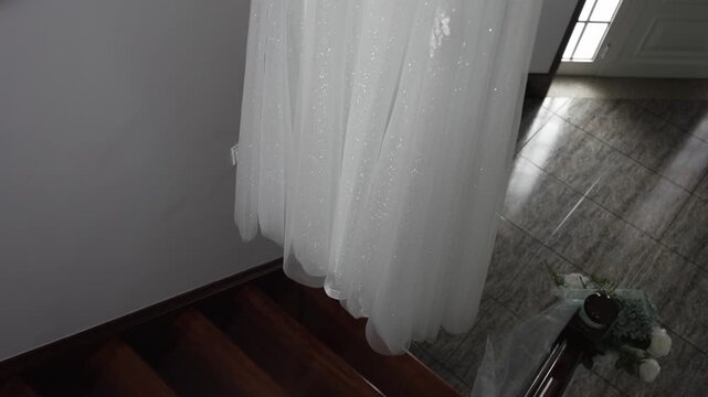 delicate tulle wedding dress hem captured in quiet indoor atmosphere