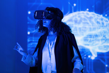 Woman wearing virtual reality headset explores digital environment in tech conference setting