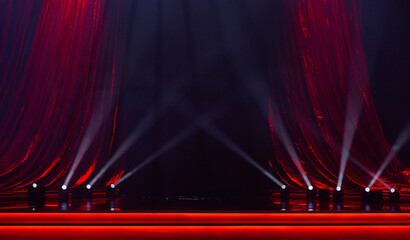red curtains with a stage and spotlights for the background