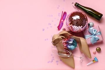 After party mess with high heels and disco balls on pink background