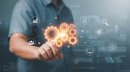 Man's hand interacts with glowing digital gears and futuristic technology icons representing innovation, strategy, data, and business processes.