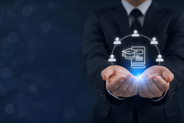 Businessman holding digital education icons with graduation cap and human resources symbols for global learning and professional development and online training for corporate team growth success