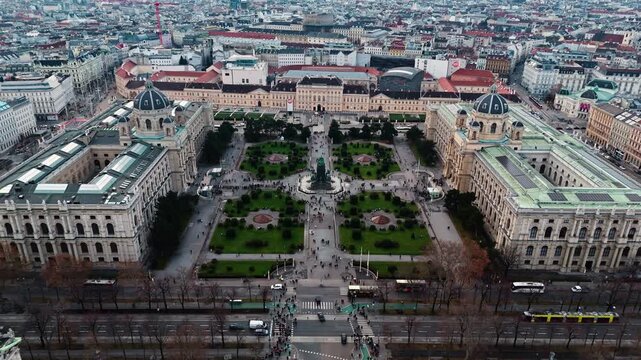 Aerial landscape drone shot panning over Austria&rsquo;s twin museums in Vienna, the Kunsthistorisches and Natural History Museums, with winter sunlight highlighting historic fa&ccedil;ades and the Vienna city