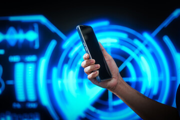 Woman using smartphone with smartwatch in futuristic blue digital interface background, representing smart technology, connectivity, innovation, data interaction, digital transformation.