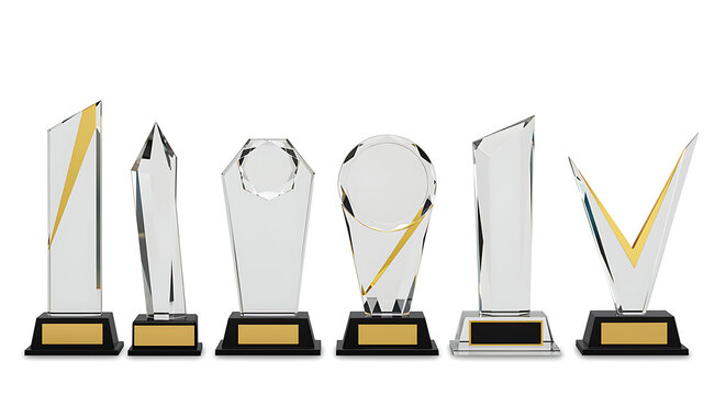 Collection of crystal trophies with gold accents on black base