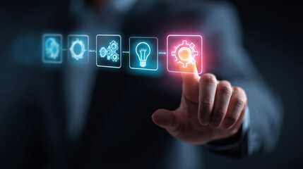Businessman hand pressing glowing gear icon on virtual screen with technology and innovation concept, showing progress and idea development