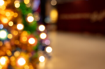 Abstract light celebration background with blurred shop or restaurant at night