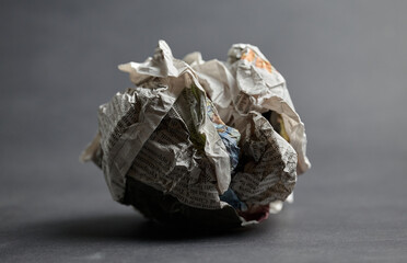 Single Crumpled Newspaper Ball with shadow