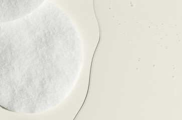 A cotton pad for removing makeup and micellar water. © mitand73