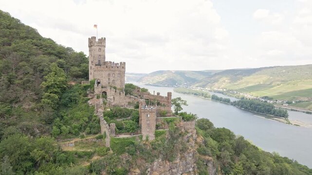 Drone shots of Reichsburg Cochem castle with the Rhine River in the background.