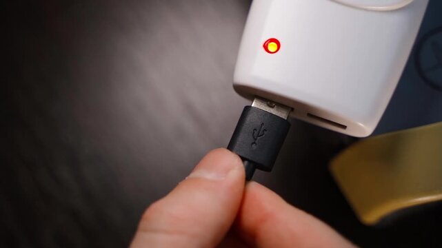 Installing a USB connector into an adapter for a socket, close-up top view