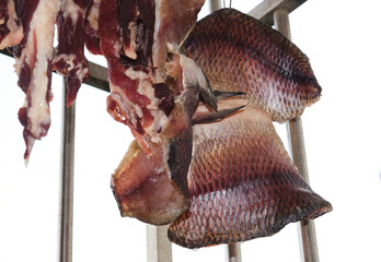 Close-up of dried fish hanging on the balcony to dry