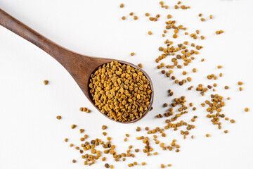 Honey bee pollen in wooden spoon