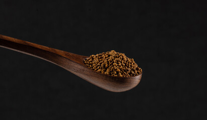 Honey bee pollen in wooden spoon
