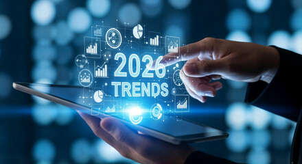 "Business Professional Holding Tablet with Holographic 2026 Trends Data and Technology Icons"
