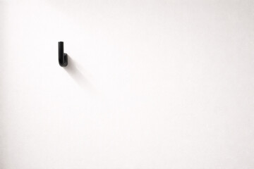 Minimal wall hook  on a clean white wall