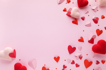 Valentine day romantic background with red and pink craft handmade hearts top view.