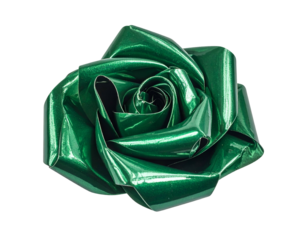 A close-up of a shiny, green, paper rose against a black background