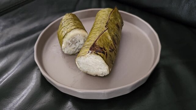cheese and breadIndonesian called Lemang or Lamang is Minang kabau ,West Sumatra traditional food,made from glutinous rice,coconut milk ,costed with banana leaves,cooked in hollowed bamboo tube,popula