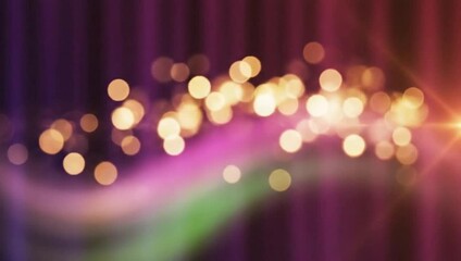 Abstract light particles moving across a dark background, creating a dynamic and vibrant visual effect.