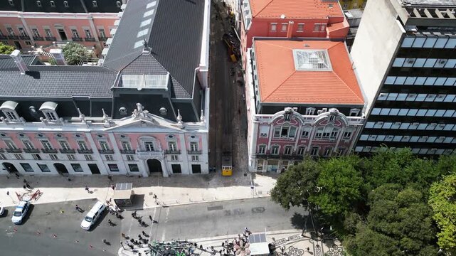 High angle aerial over the Gloria Funicular tram crash site in Lisbon, sunny day