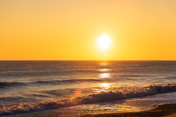 Golden Sunrise Over the Ocean Horizon