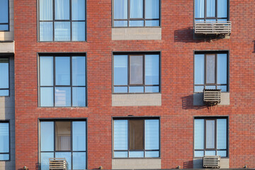Fototapeta premium The facade of a modern residential building, the texture of the building
