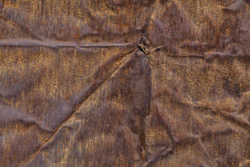 rusty red crumpled flat sheet metal surface full-frame background and texture.