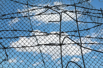 Fence with a cloud in the sky