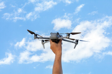 Person is holding a drone in their hand