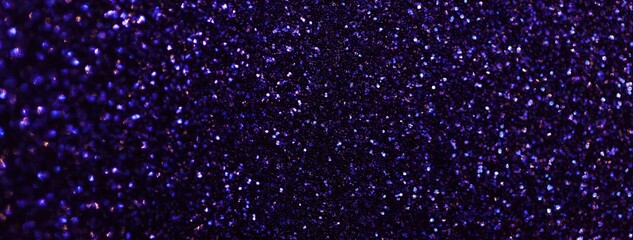 Navy blue sparkling background from small sequins, macro. Shiny dark glitter backdrop for Christmas or New Year