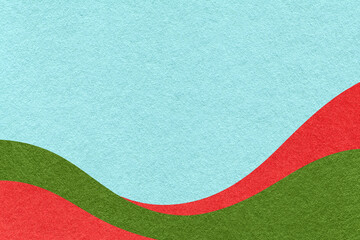 Textured pastel blue paper background with red and green wavy lines and waves, copy space for banner, presentation