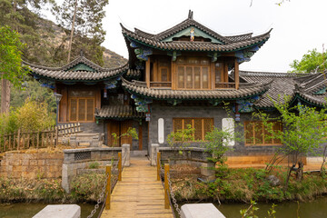 Obraz premium Beautiful architecture of Dongba Culture Research Institute at Black Dragon Pool Park in Lijiang Old Town, China