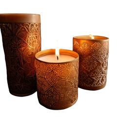 Three lit candles in embossed, patterned holders
