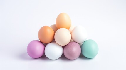 Colorful eggs stacked in a pyramid on a white background