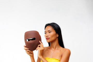 Portrait series of woman interacting with LED facial mask for skincare, beauty tech, and light therapy. Concept of modern wellness and self-care innovation.