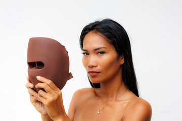 Portrait series of woman interacting with LED facial mask for skincare, beauty tech, and light therapy. Concept of modern wellness and self-care innovation.