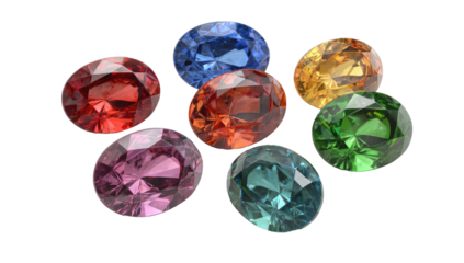 Assortment of vibrant, faceted oval gemstones, presented on a stark black backdrop