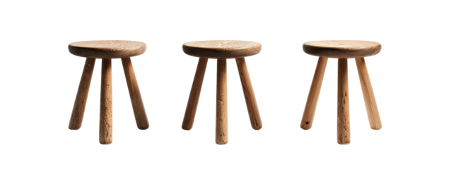 Three minimalist wooden stools arranged side-by-side against a black background. Focused studio lighting
