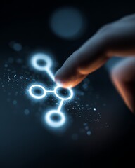 Human finger pressing a glowing workflow nodes icon on a digital interface, representing process flow and automation logic.