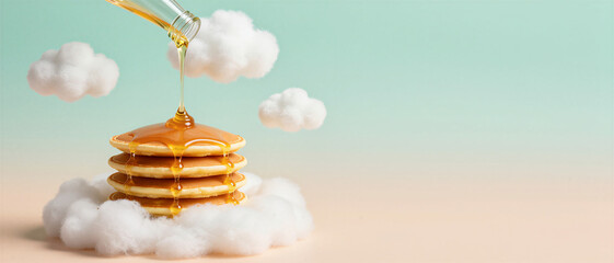 Maple syrup pouring over a stack of golden pancakes resting on soft cotton clouds against a pastel gradient background. International Pancake Day.