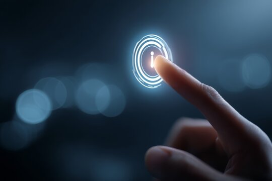 Human finger pressing a glowing information icon on a digital interface, representing help, guidance, or informational access.