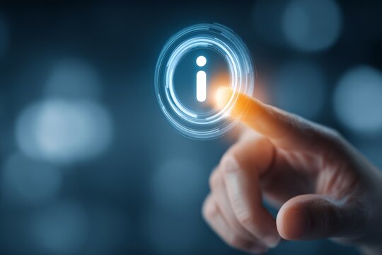 Human finger pressing a glowing information icon on a digital interface, representing help, guidance, or informational access.